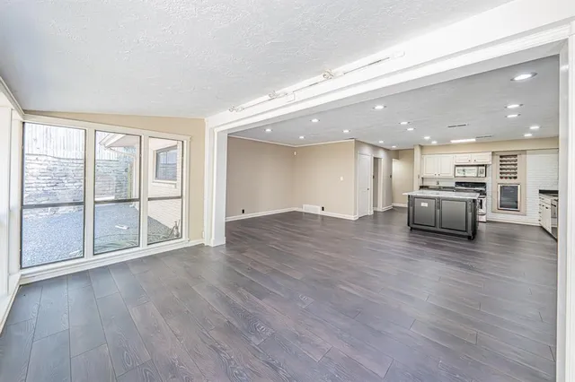 a view of kitchen with furniture and wooden floor