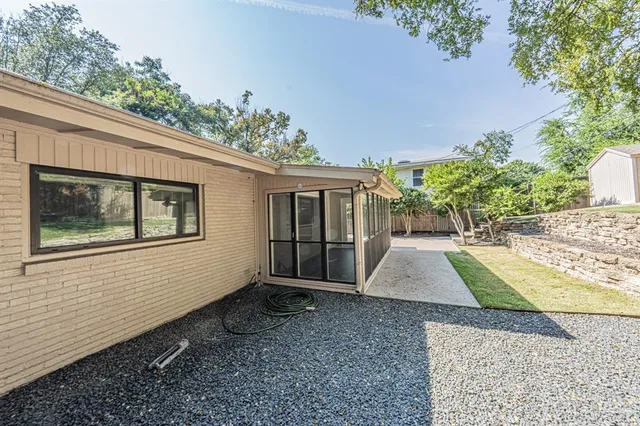a house with trees in the background