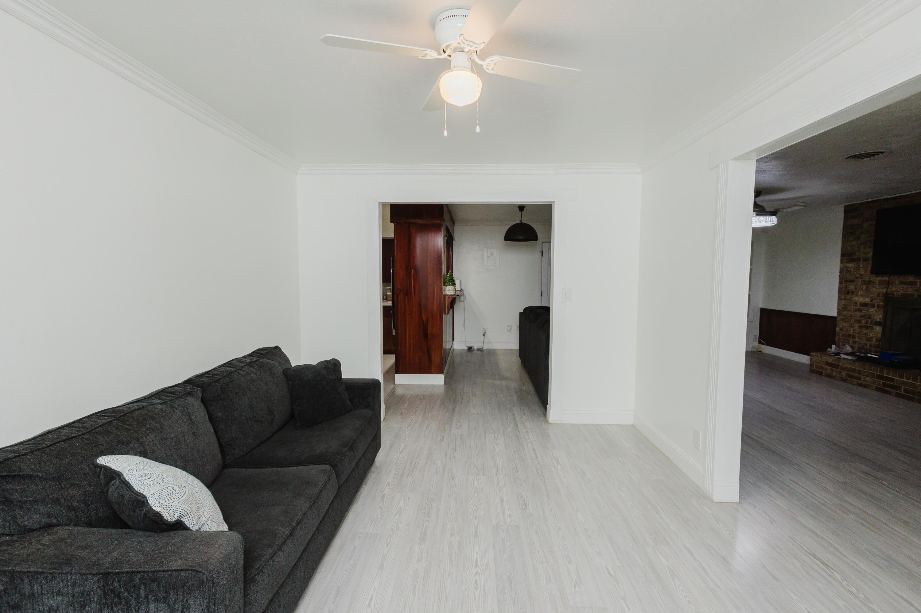 2110 57th Street Lubbock, TX 79412 - Photo 11 of 49 a living room with furniture and a ceiling fan