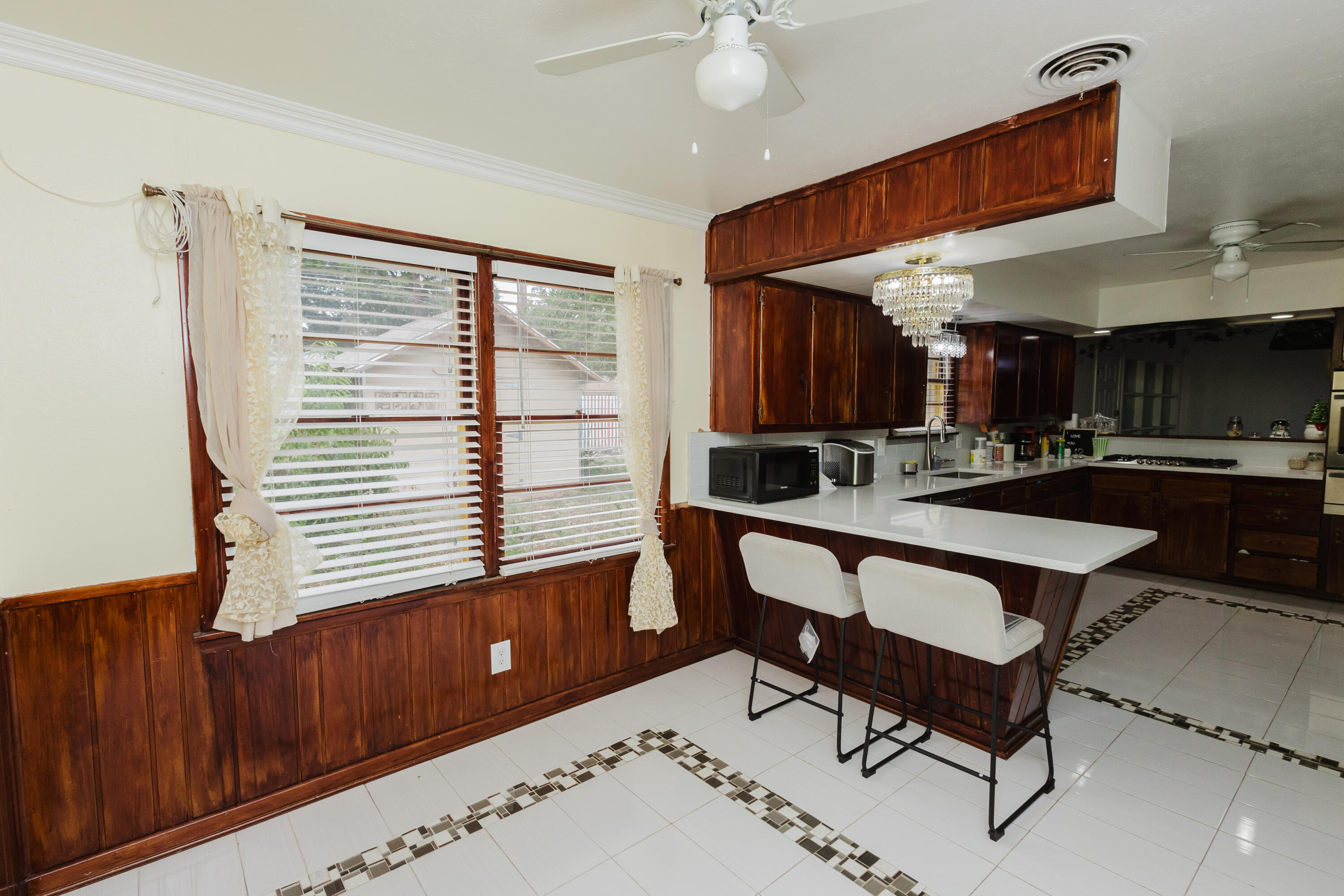 2110 57th Street Lubbock, TX 79412 - Photo 19 of 49 a kitchen with a sink a counter space and a window