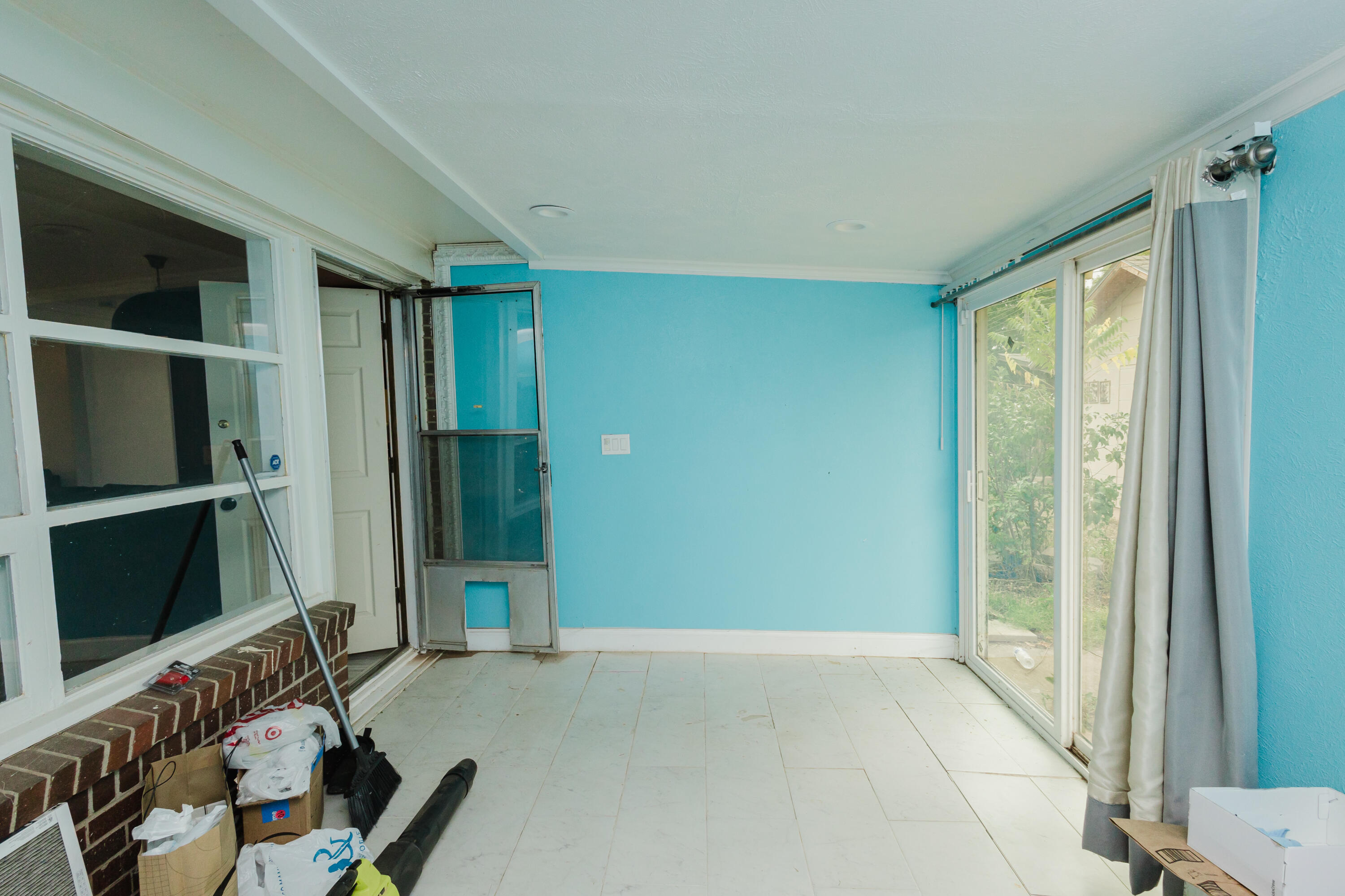 2110 57th Street Lubbock, TX 79412 - Photo 41 of 49 a living room with a fireplace and a large window