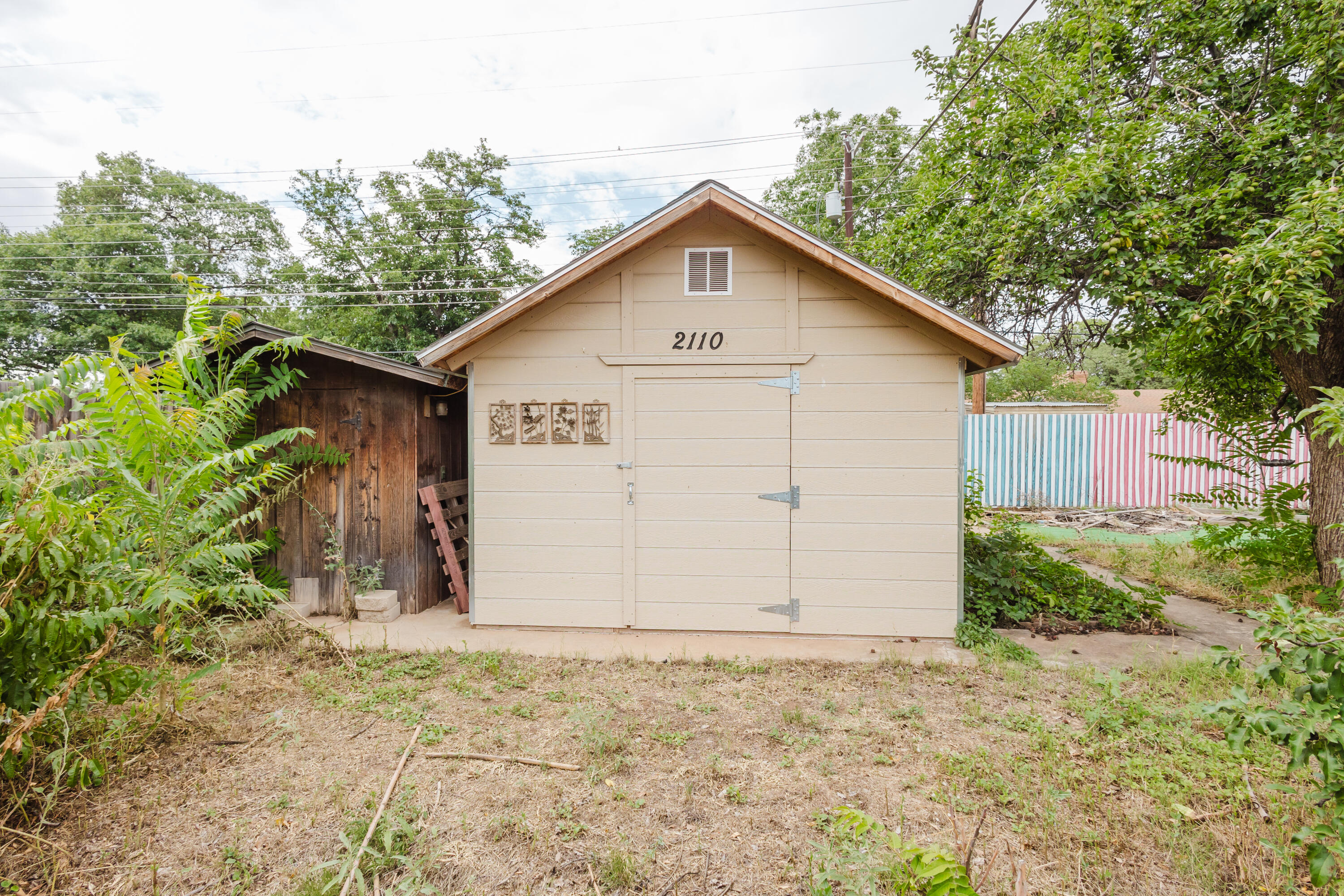 2110 57th Street Lubbock, TX 79412 - Photo 49 of 49 a view of a house with a yard and garage
