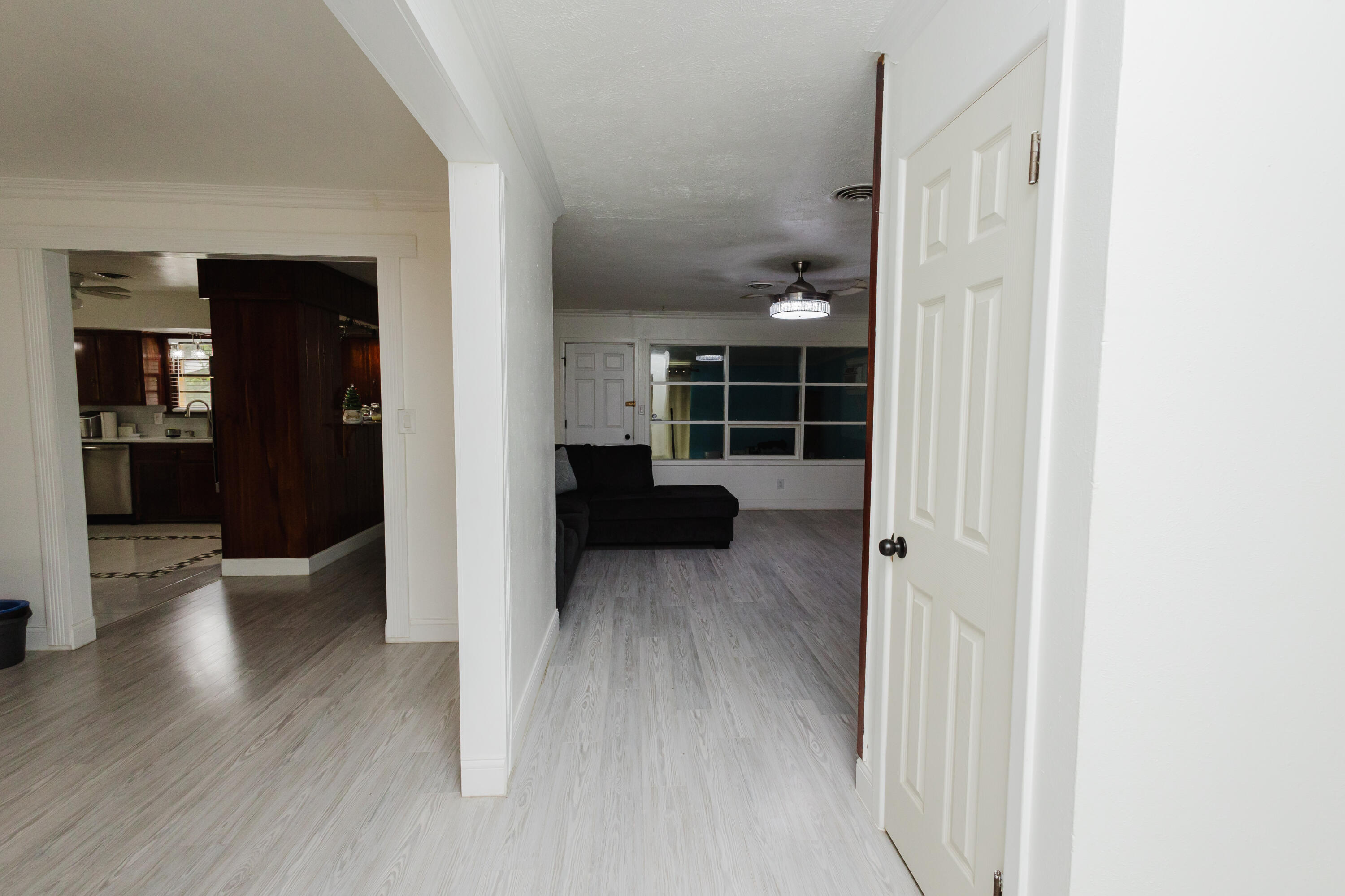 2110 57th Street Lubbock, TX 79412 - Photo 5 of 49 a view of empty room with wooden floor and windows