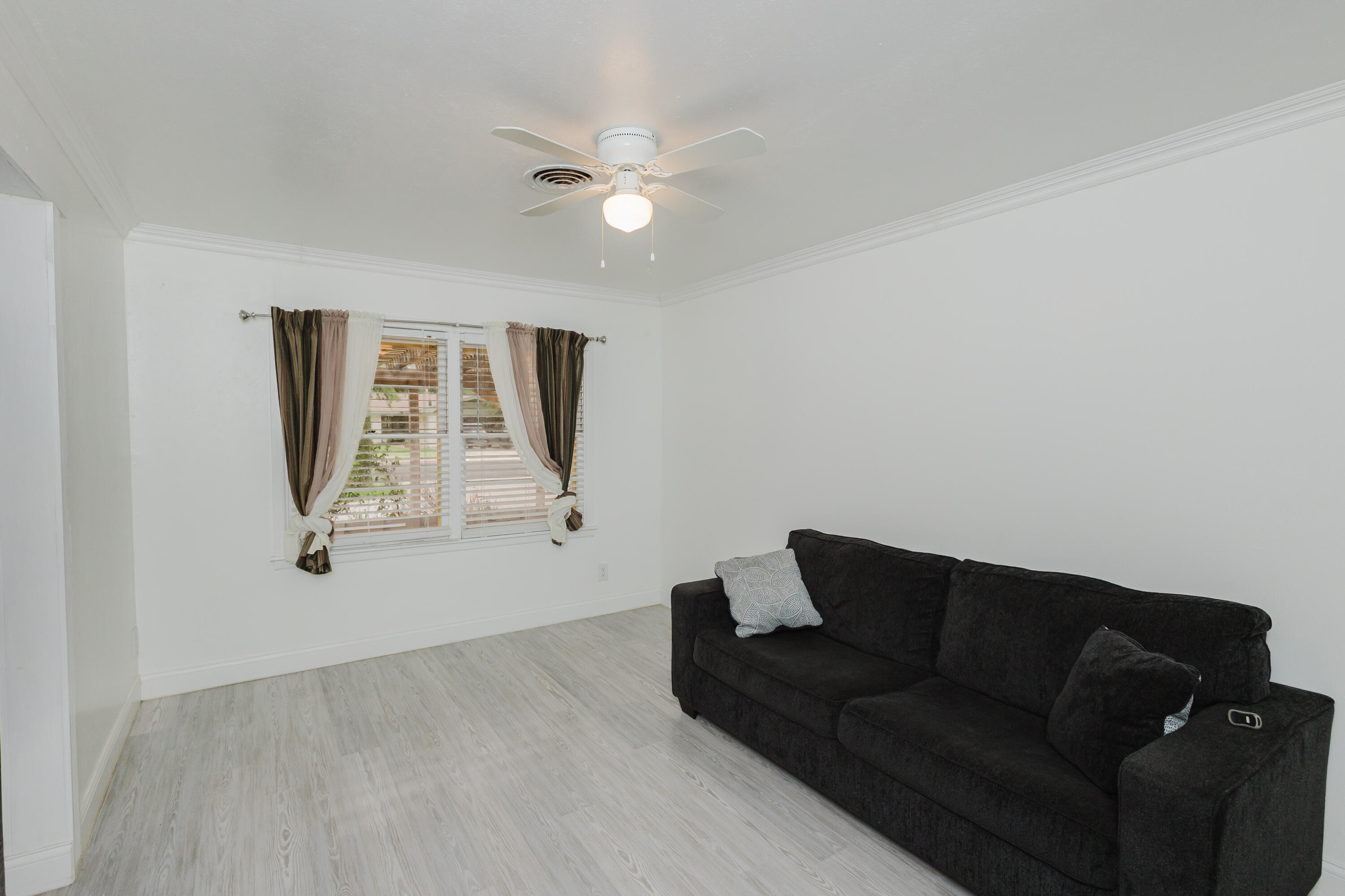 2110 57th Street Lubbock, TX 79412 - Photo 8 of 49 a living room with furniture and a window