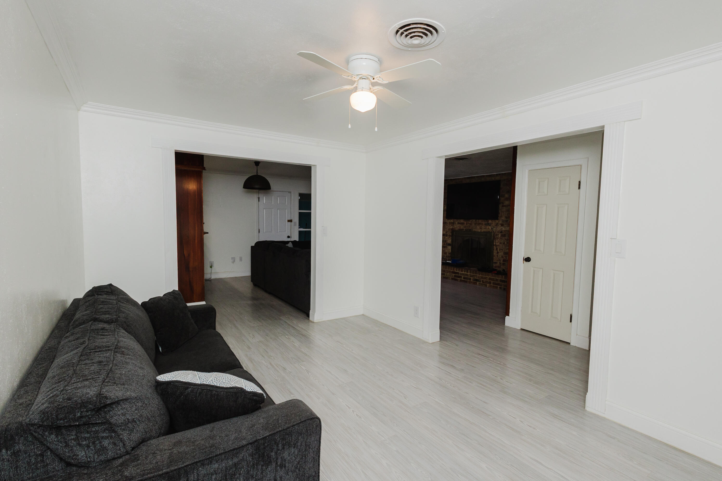 2110 57th Street Lubbock, TX 79412 - Photo 10 of 49 a living room with furniture and a ceiling fan