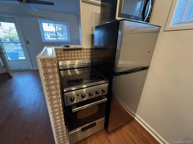 a view of washer and dryer with wooden floor