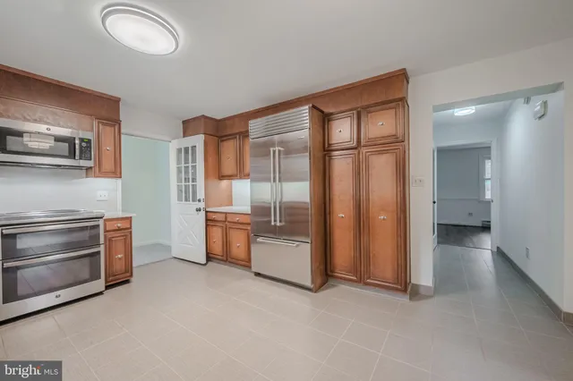 a room with furniture and a kitchen