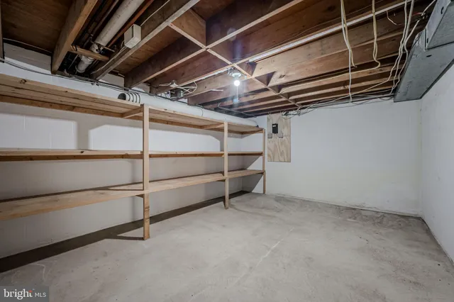 a view of an empty room with racks on the wall