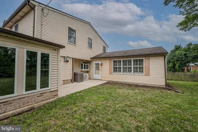 a front view of a house with a yard and porch