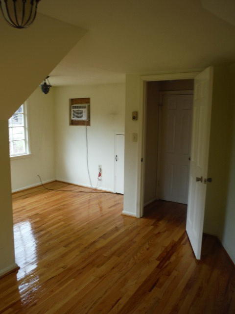 6294 Dillons Mill Road Callaway, VA 24067 - Photo 16 of 23 an empty room with wooden floor and windows