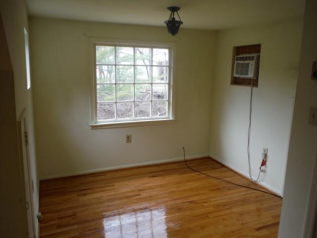 6294 Dillons Mill Road Callaway, VA 24067 - Photo 17 of 23 an empty room with wooden floor and windows