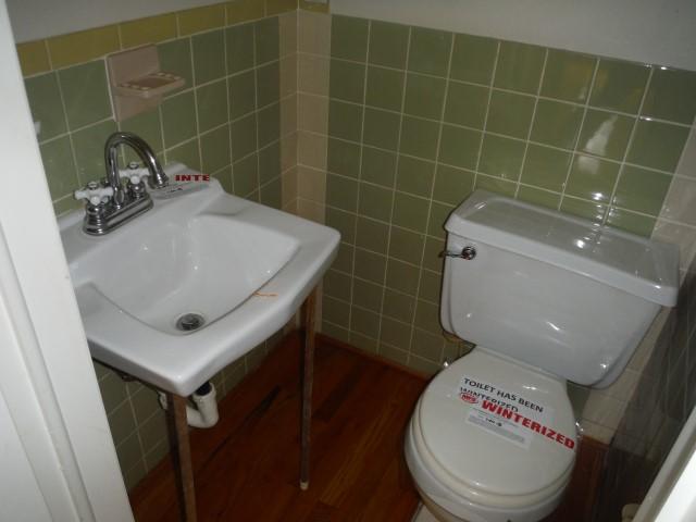 6294 Dillons Mill Road Callaway, VA 24067 - Photo 18 of 23 a bathroom with a sink a toilet and a mirror