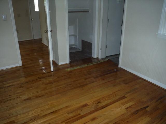 6294 Dillons Mill Road Callaway, VA 24067 - Photo 6 of 23 an empty room with wooden floor and entrance