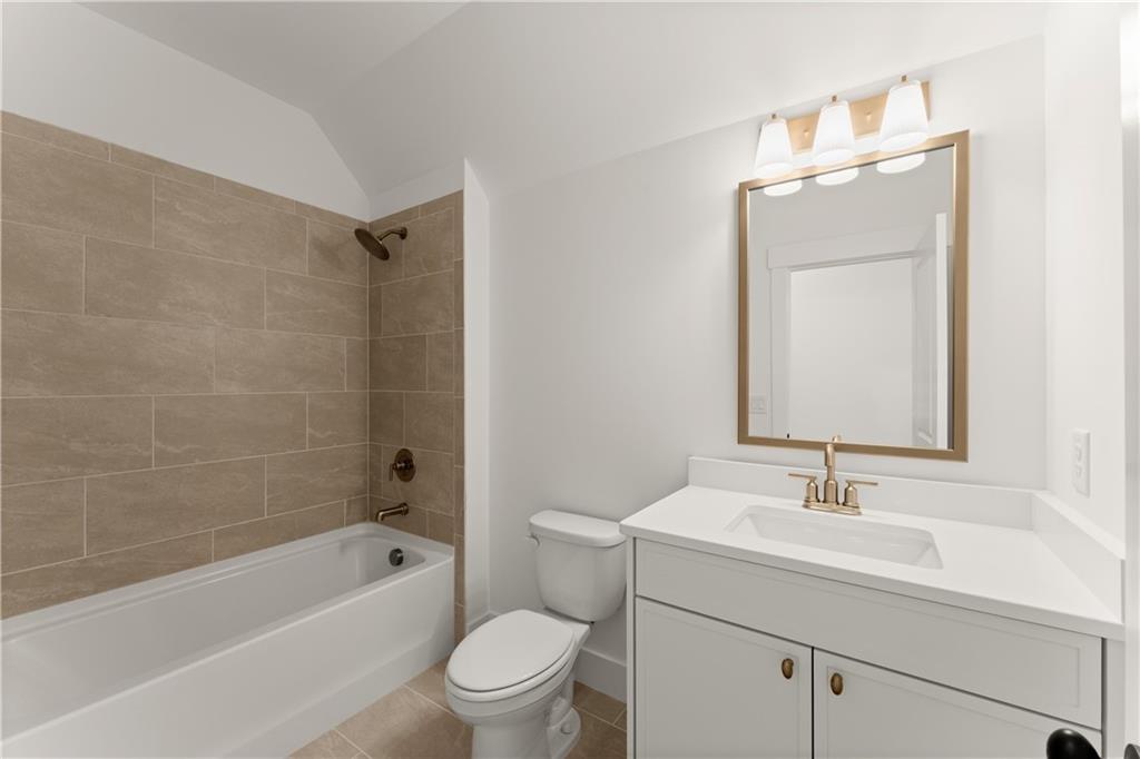 285 Reese Way Ball Ground, GA 30107 - Photo 24 of 30 a bathroom with a sink a toilet and shower