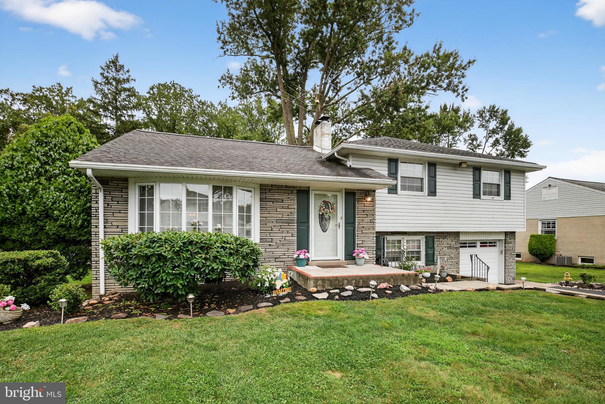 a view of a house with a yard porch and sitting area