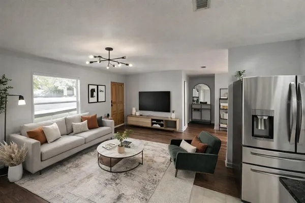 a living room with furniture and a flat screen tv