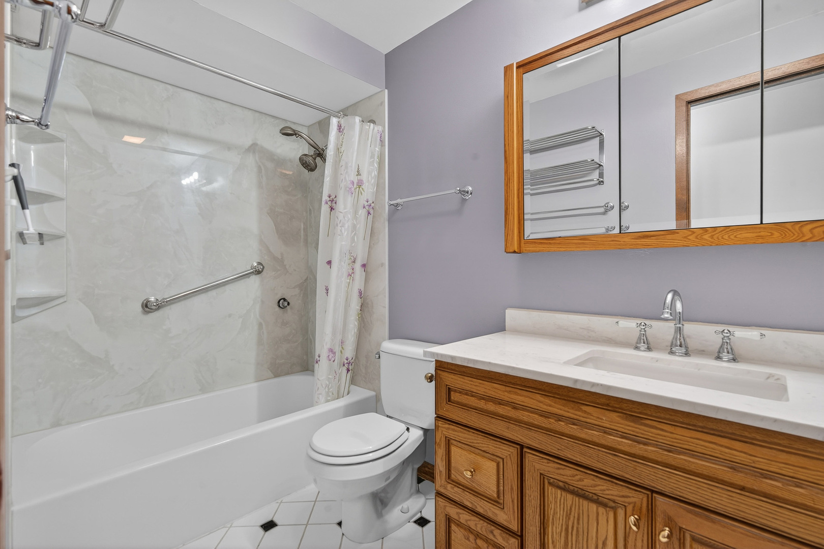 1790 Devonshire Court Elgin, IL 60123 - Photo 15 of 27 a bathroom with a sink a toilet and shower