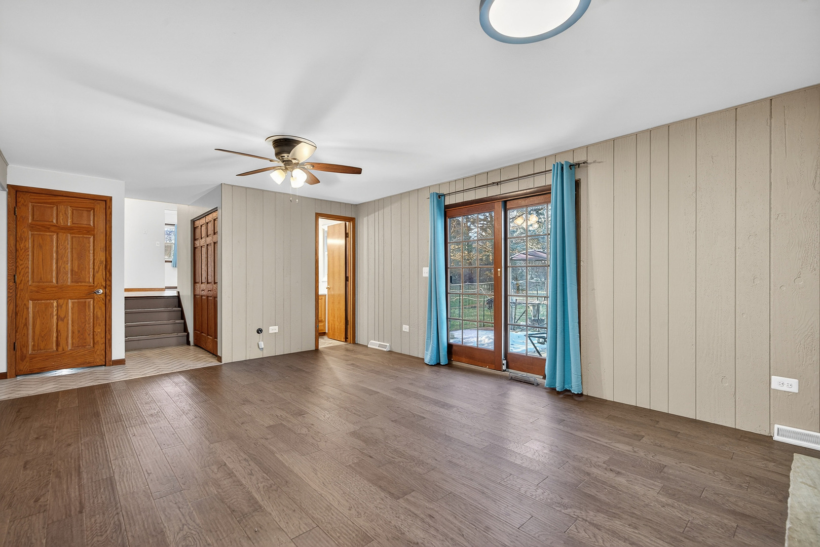 1790 Devonshire Court Elgin, IL 60123 - Photo 17 of 27 a view of an empty room with a window and wooden floor
