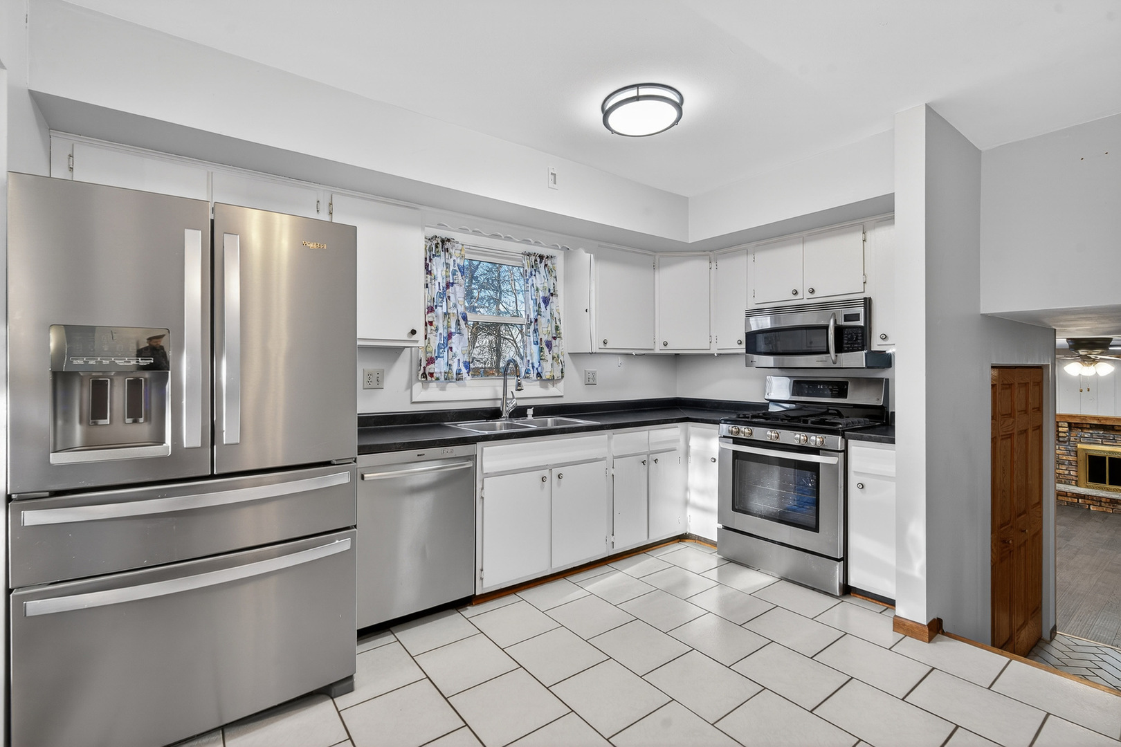 1790 Devonshire Court Elgin, IL 60123 - Photo 7 of 27 a kitchen with granite countertop stainless steel appliances and cabinets