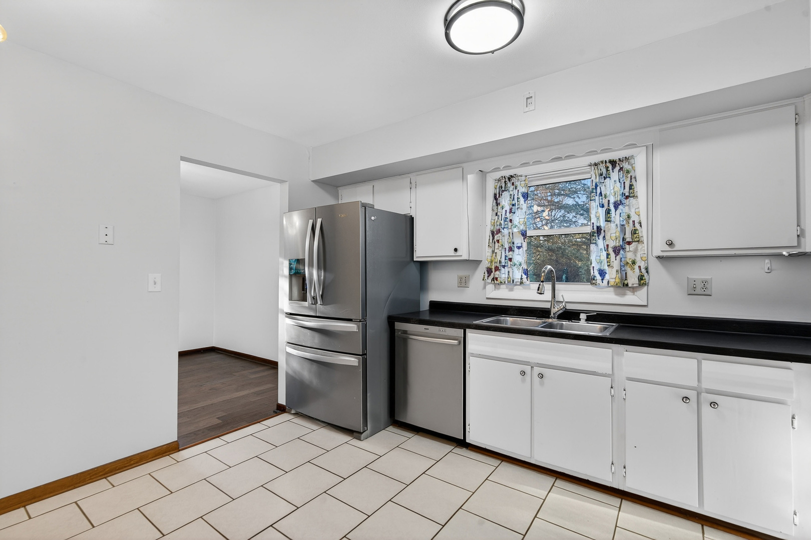 1790 Devonshire Court Elgin, IL 60123 - Photo 8 of 27 a kitchen with granite countertop a sink cabinets and stainless steel appliances