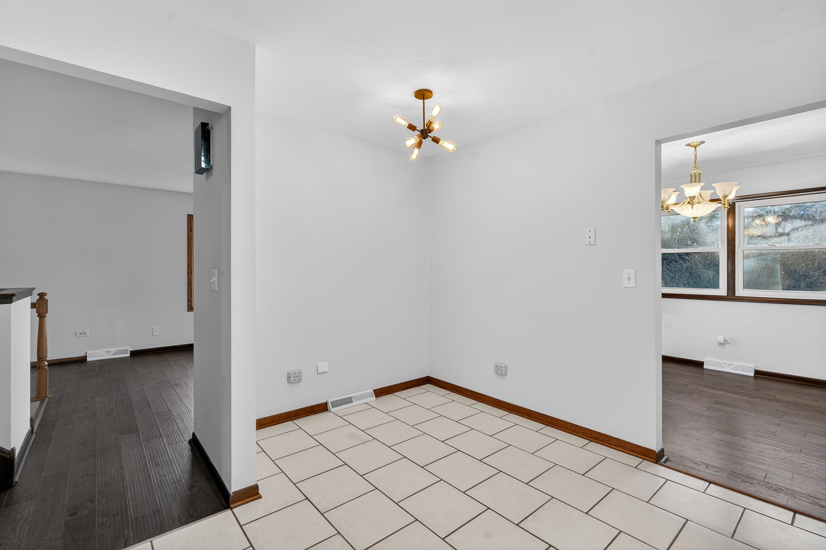 1790 Devonshire Court Elgin, IL 60123 - Photo 9 of 27 an empty room with wooden floor and cabinet