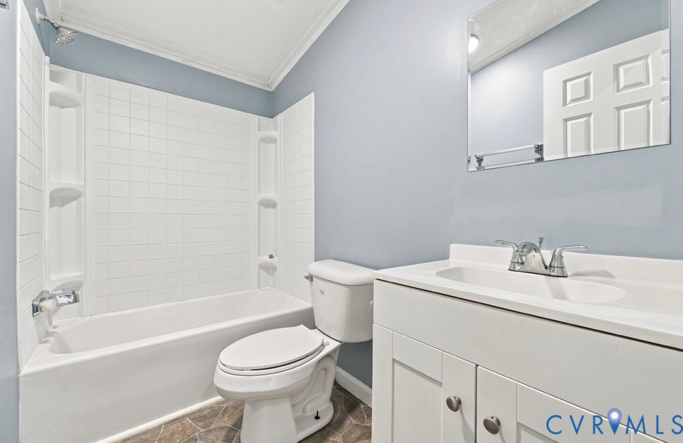 977 Burchs Mill Road Urbanna, VA 23175 - Photo 22 of 38 White vanity with integrated sink, and wall-mounte
