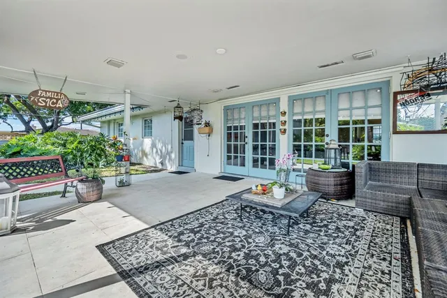 a view of a chairs and table in a patio
