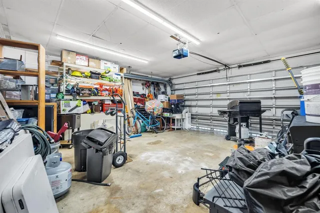 a front view of a house with a yard and a garage