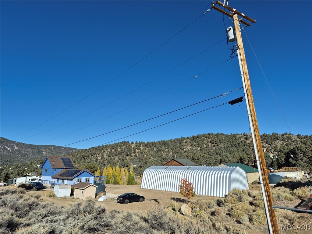 0 Rustic Canyon Road Big Bear City, CA 92314 - Photo 8 of 11 a bedroom with furniture and a roof