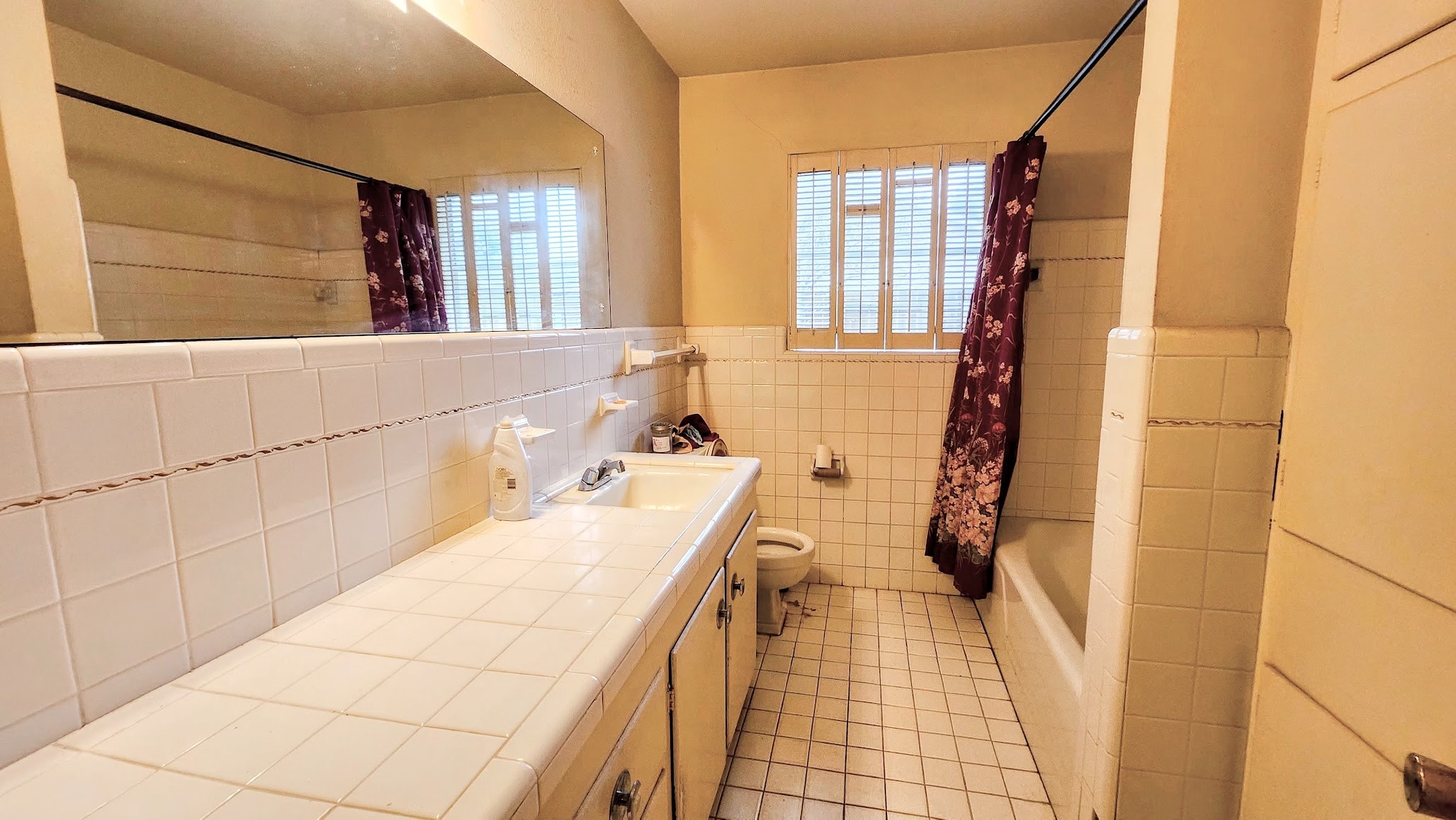 1927 Bethlehem Street Houston, TX 77018 - Photo 18 of 25 a bathroom with a sink a mirror and a shower