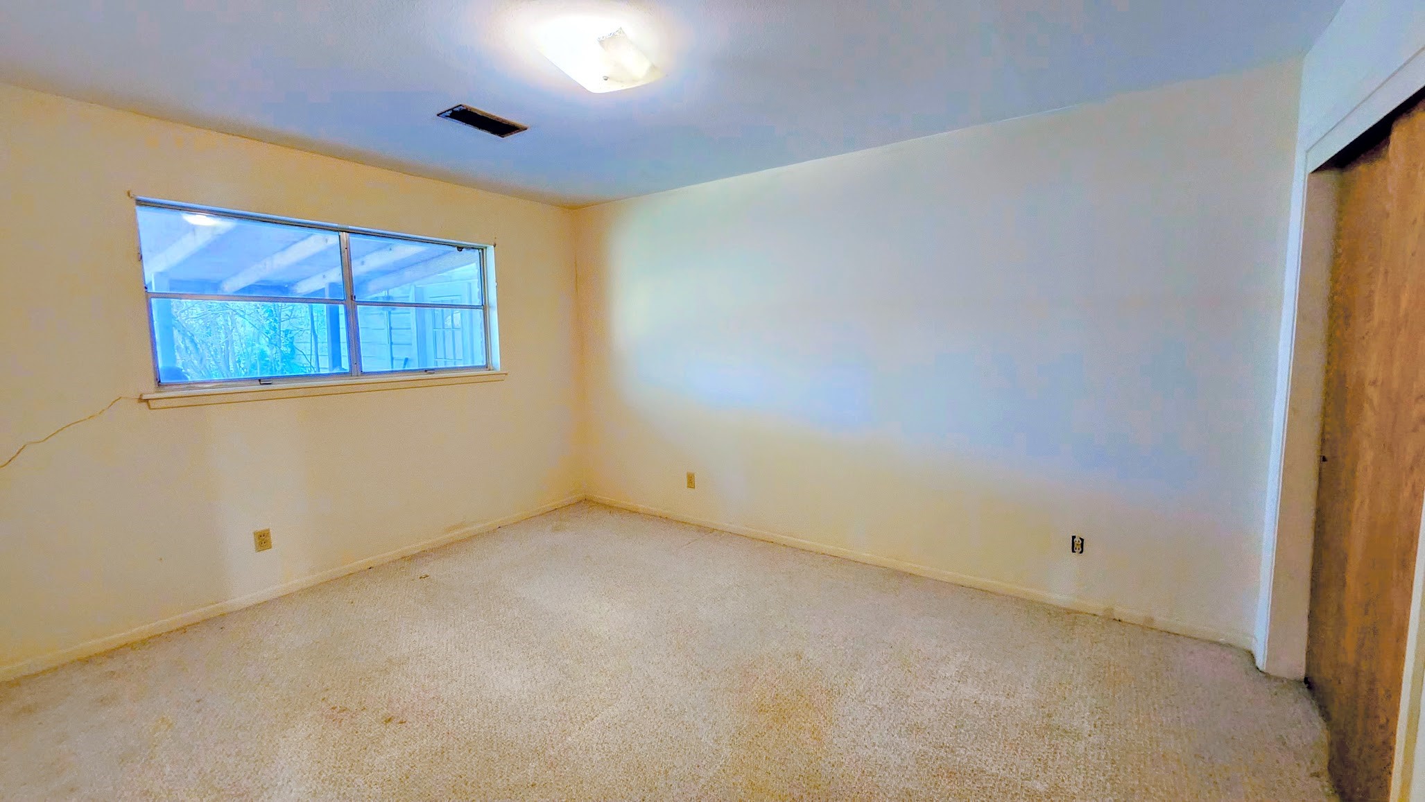 1927 Bethlehem Street Houston, TX 77018 - Photo 22 of 25 a view of an empty room with a window