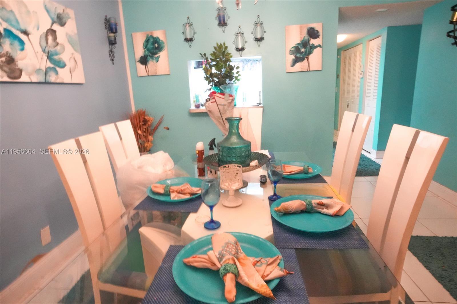 3774 Inverrary Boulevard, Unit 101P Lauderhill, FL 33319 - Photo 7 of 11 a dining room with furniture and wooden floor