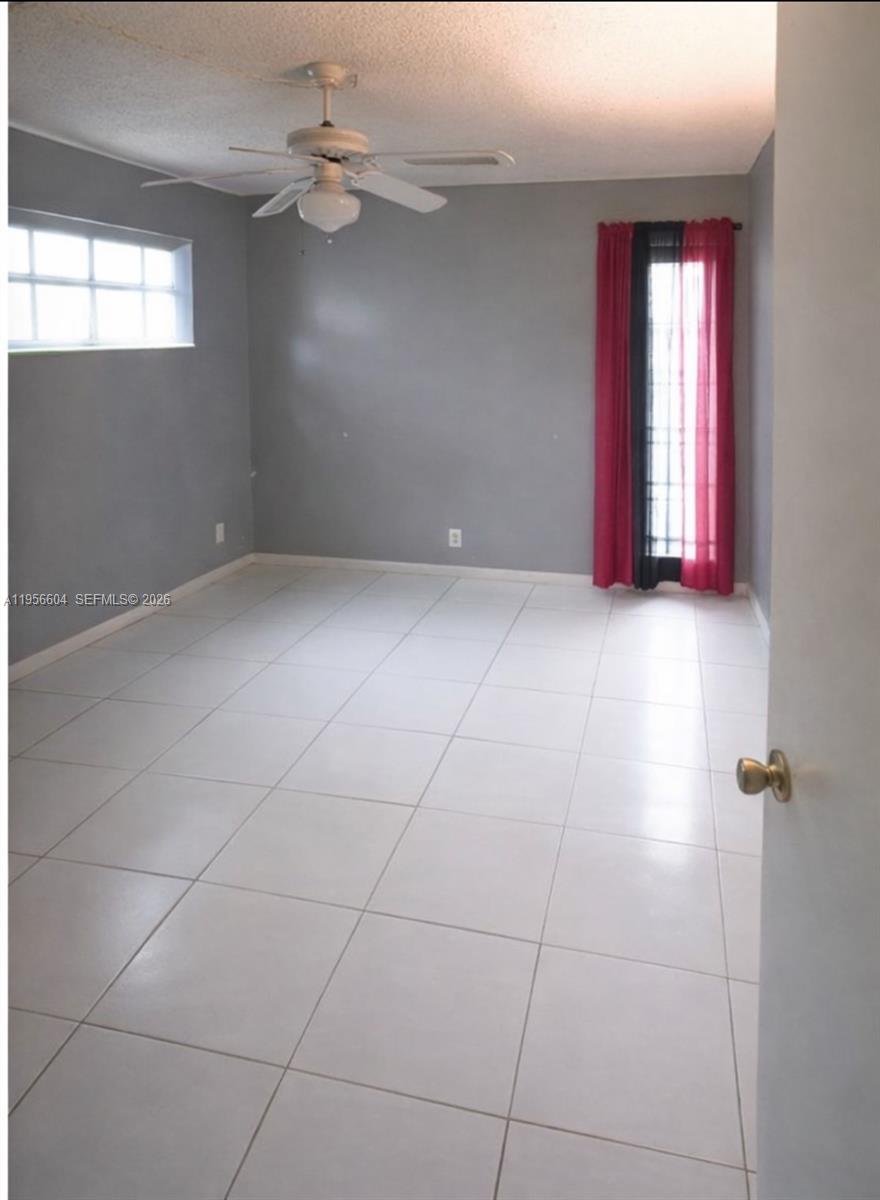 3774 Inverrary Boulevard, Unit 101P Lauderhill, FL 33319 - Photo 10 of 11 a view of an empty room with a window
