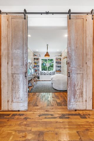 a view of living room filled with furniture and a rug