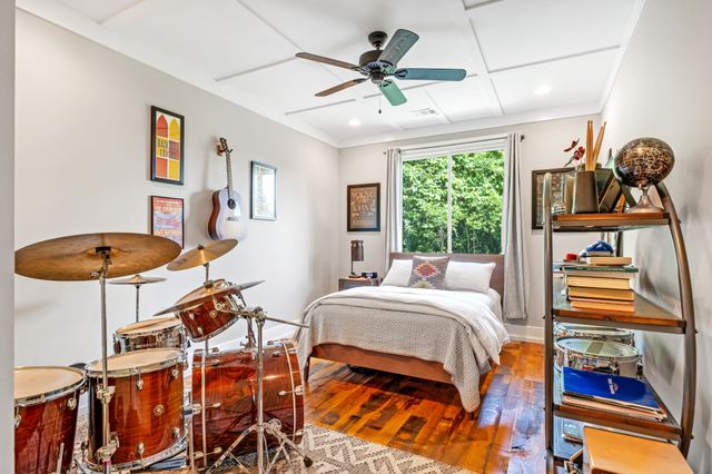 a bedroom with furniture and a window