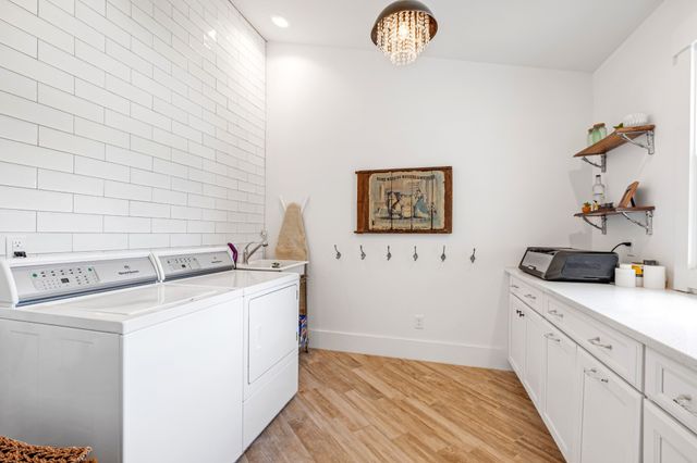 a view of a storage & utility room with washer and dryer