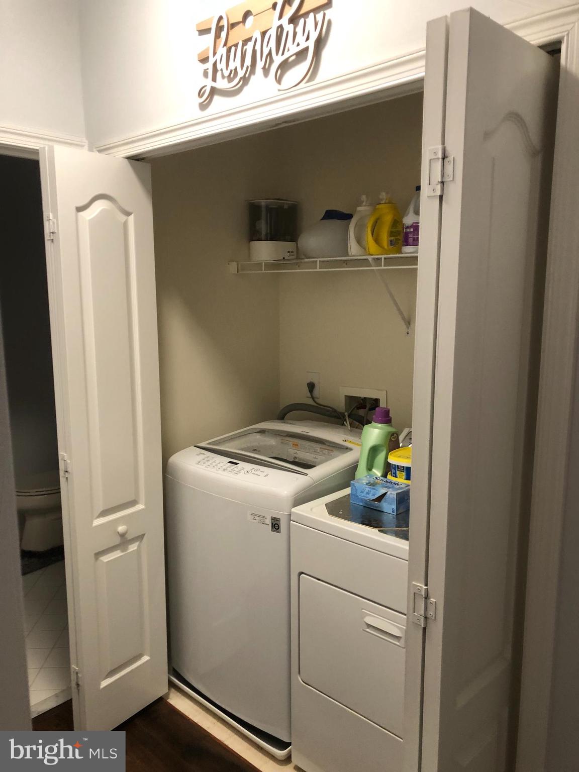 239 Carson Terrace, Unit 239 Huntingdon Valley, PA 19006 - Photo 13 of 19 a utility room with dryer and washer