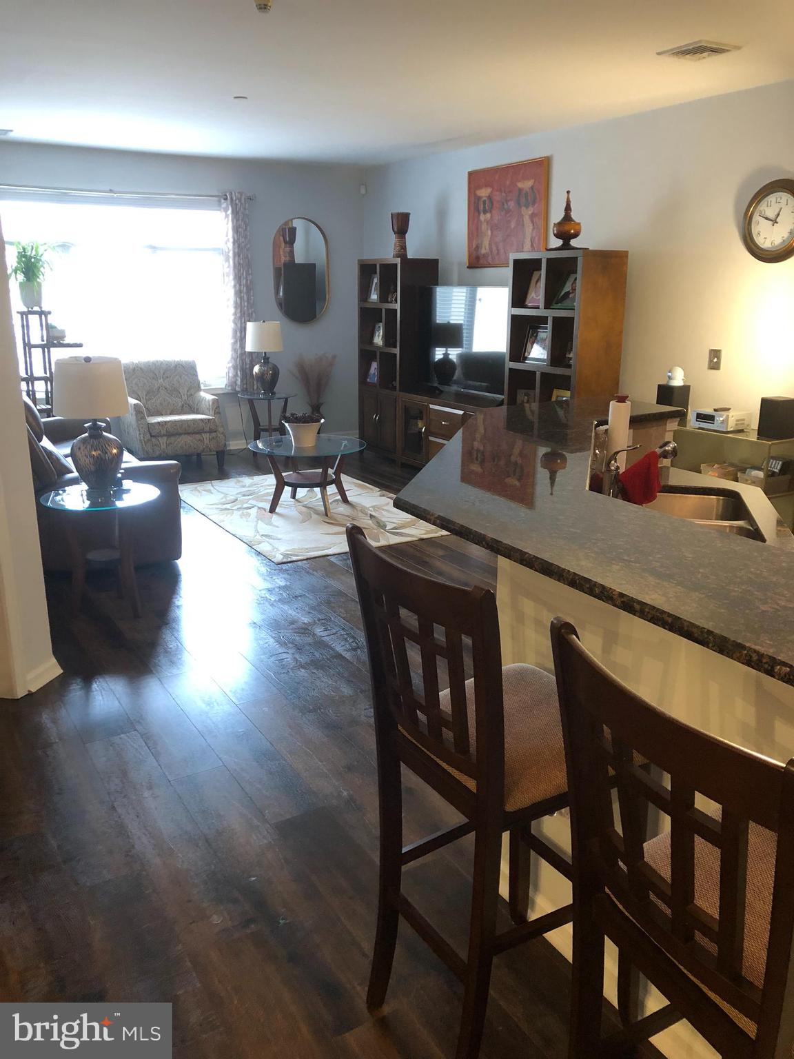 239 Carson Terrace, Unit 239 Huntingdon Valley, PA 19006 - Photo 5 of 19 a living room with furniture and wooden floor