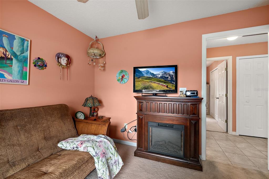 8 Karat Path Palm Coast, FL 32164 - Photo 14 of 37 a living room with furniture and a fireplace