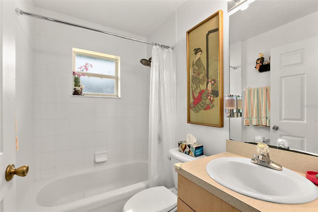 8 Karat Path Palm Coast, FL 32164 - Photo 15 of 37 a bathroom with a sink and mirror with toilet
