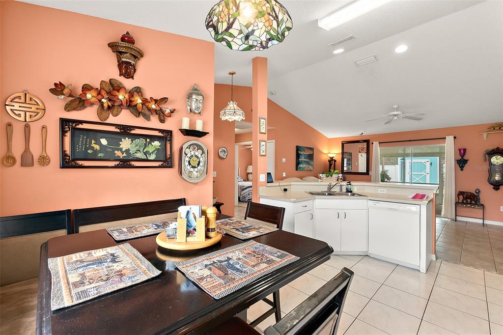 8 Karat Path Palm Coast, FL 32164 - Photo 18 of 37 a open dining room with furniture and a chandelier