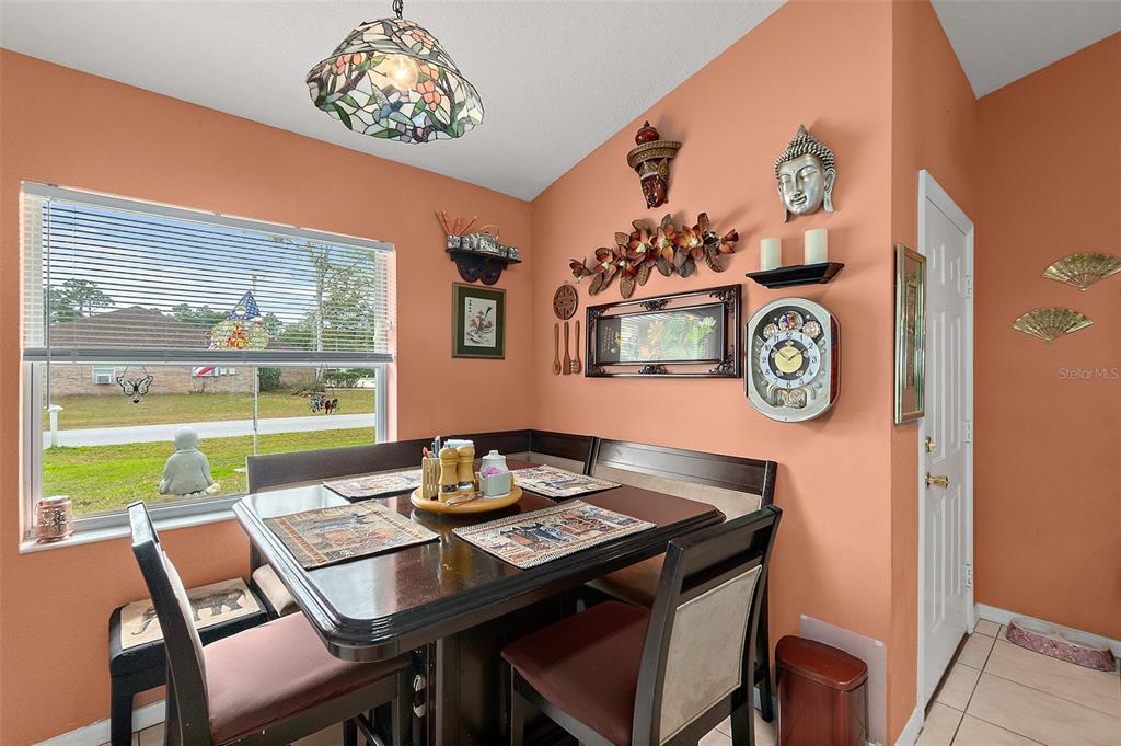 8 Karat Path Palm Coast, FL 32164 - Photo 19 of 37 a view of a dining room with a table and chairs