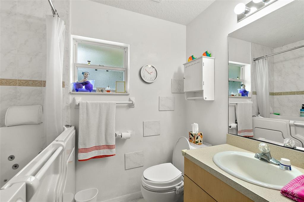 8 Karat Path Palm Coast, FL 32164 - Photo 25 of 37 a bathroom with a sink toilet vanity and tub