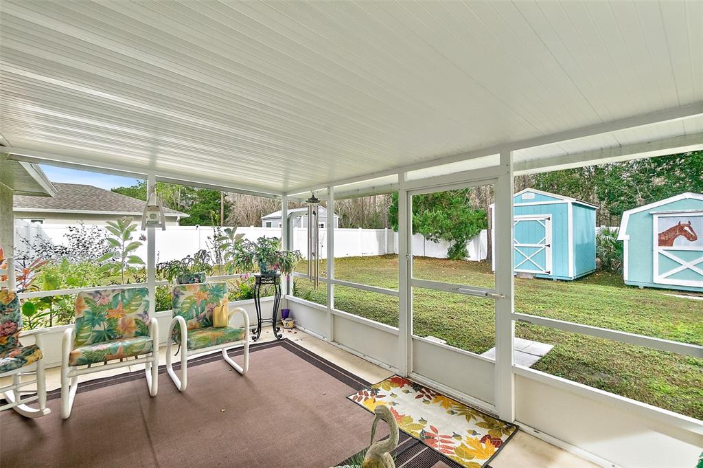 8 Karat Path Palm Coast, FL 32164 - Photo 28 of 37 a view of a porch with furniture and a yard