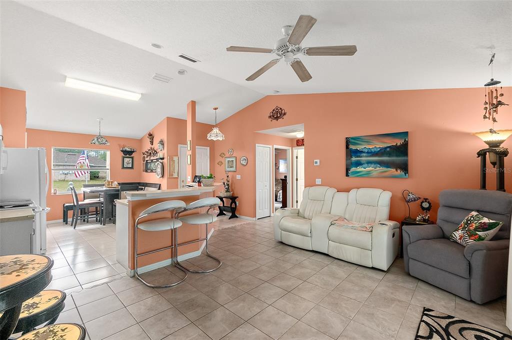 8 Karat Path Palm Coast, FL 32164 - Photo 4 of 37 a living room with furniture and a large window