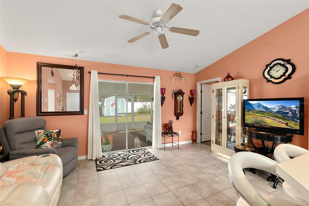 8 Karat Path Palm Coast, FL 32164 - Photo 6 of 37 a living room with furniture a flat screen tv and a large window