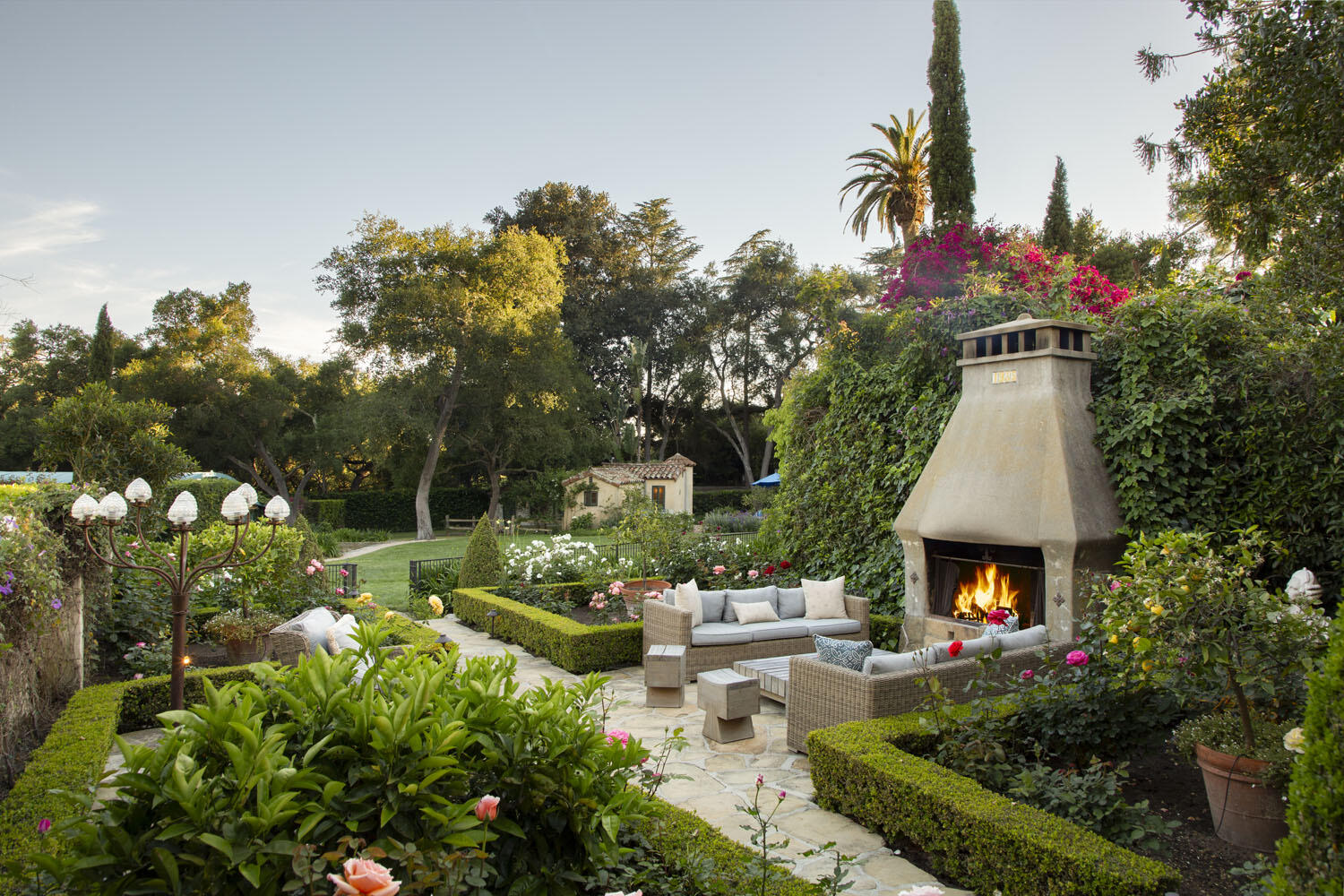 779 Ayala Lane Montecito, CA 93108 - Photo 12 of 58 a front view of a house with a garden and fire pit
