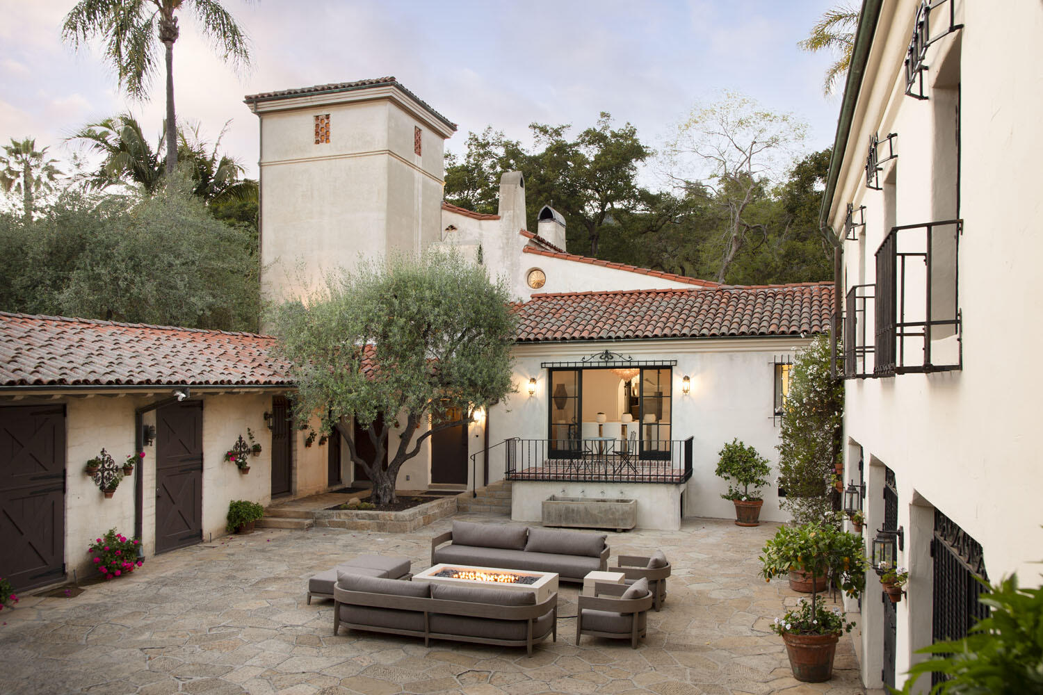 779 Ayala Lane Montecito, CA 93108 - Photo 15 of 58 a view of a patio with couches table and chairs and potted plants