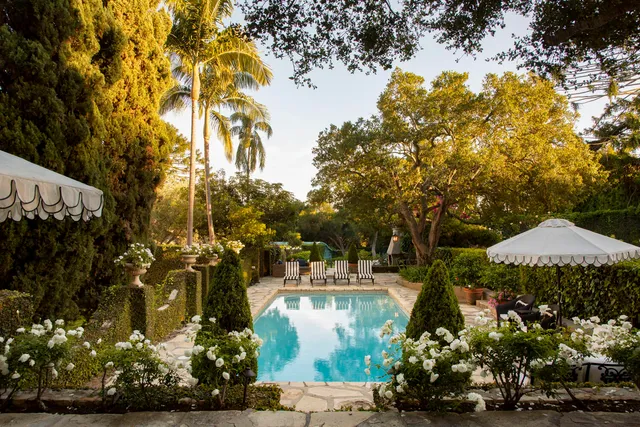 swimming pool view with a seating space