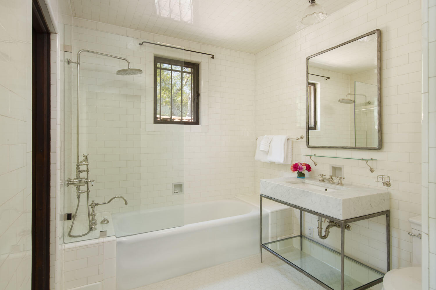 779 Ayala Lane Montecito, CA 93108 - Photo 35 of 58 a bathroom with a bathtub sink vanity and mirror